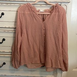Dusty pink sheer top. Textured with buttons on front and billowy sleeves. S-lg